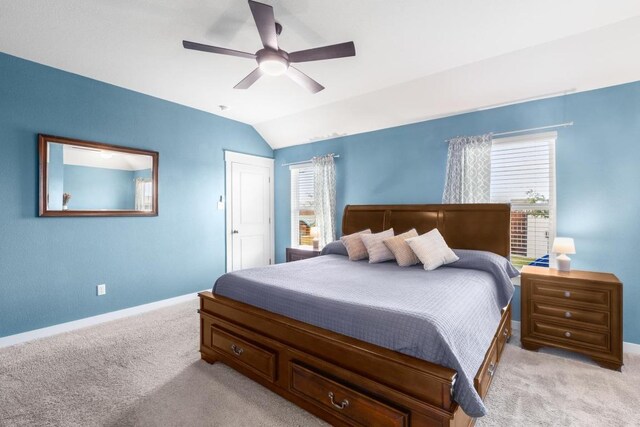 17109 Calipatria Ln, Pflugerville, TX 78660 - bedroom featuring light colored carpet, multiple windows, vaulted ceiling, and a ceiling fan