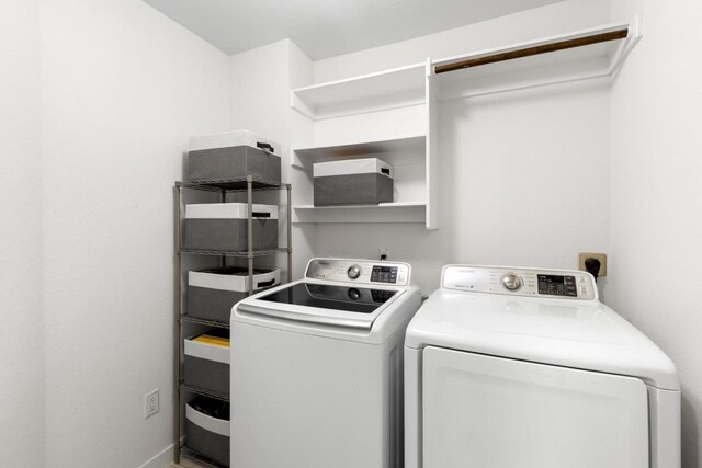 17109 Calipatria Ln, Pflugerville, TX 78660 - laundry room featuring separate washer and dryer and baseboards