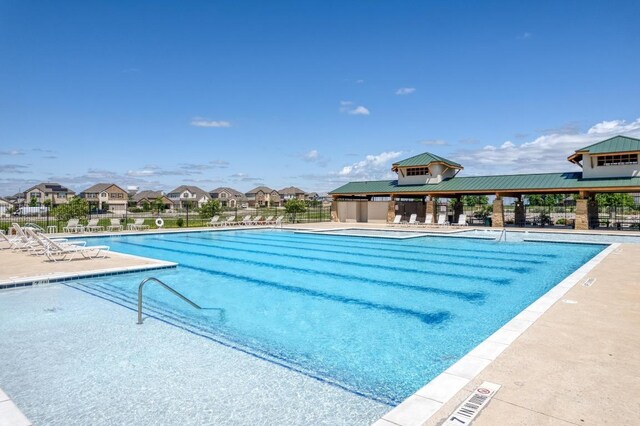 17109 Calipatria Ln, Pflugerville, TX 78660 - community pool featuring a patio and a residential view
