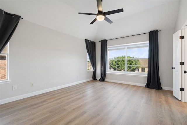 1006 Mesquite Hollow Pl, Round Rock, TX 78665 - empty room featuring ceiling fan, light wood-style floors, vaulted ceiling, and baseboards