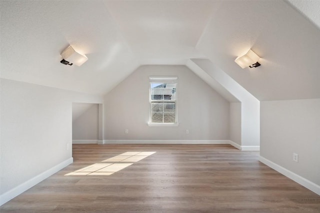 1006 Mesquite Hollow Pl, Round Rock, TX 78665 - bonus room featuring wood finished floors, lofted ceiling, and baseboards