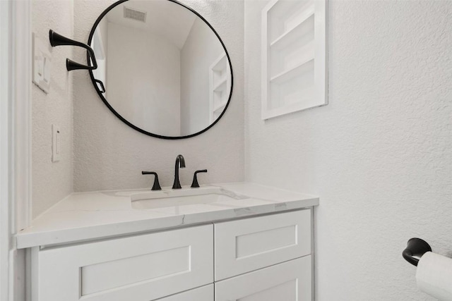 1006 Mesquite Hollow Pl, Round Rock, TX 78665 - bathroom featuring vanity and a textured wall