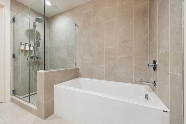 full bathroom featuring recessed lighting, tile patterned flooring, a bath, tile walls, and a stall shower