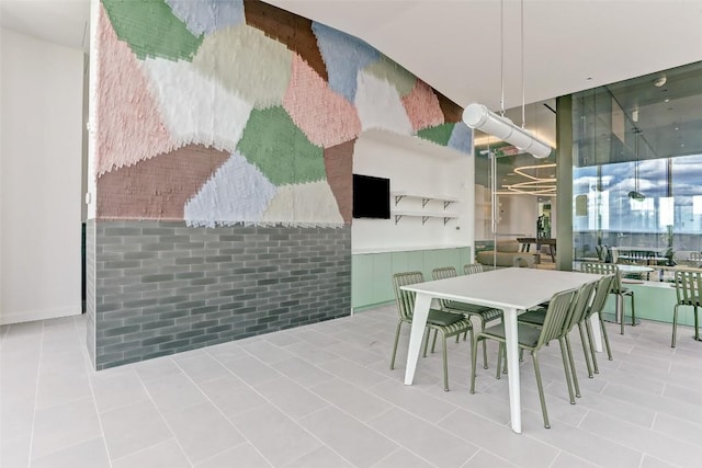 dining area featuring tile patterned flooring