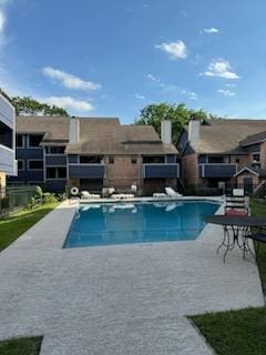 2500 Burleson Rd Unit 604, Austin, TX 78741 - community pool featuring a patio
