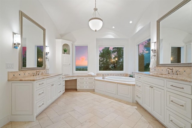 bathroom with vaulted ceiling, tasteful backsplash, and a sink