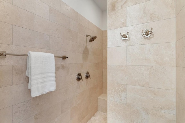 full bath with tiled shower
