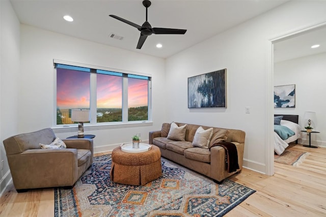 living room with ceiling fan, wood finished floors, visible vents, and recessed lighting