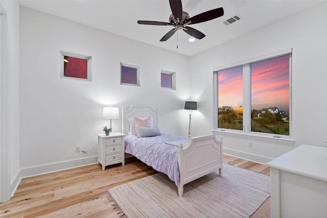 bedroom with recessed lighting, light wood finished floors, visible vents, a ceiling fan, and baseboards