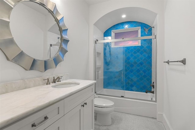 bathroom with shower / bath combination with glass door, tile patterned floors, vanity, and toilet