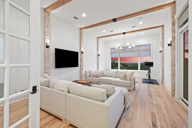 living room with recessed lighting, a notable chandelier, visible vents, and light wood-style flooring