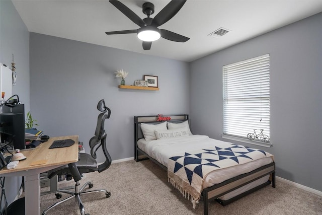 bedroom with carpet floors, a ceiling fan, visible vents, and baseboards