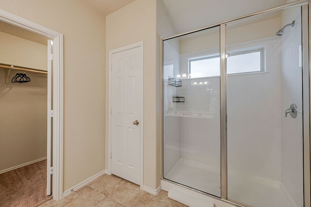 850 Hobby Rd, Copperas Cove, TX 76522 - bathroom with a shower stall, a spacious closet, and baseboards