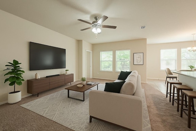 850 Hobby Rd, Copperas Cove, TX 76522 - carpeted living room featuring a ceiling fan, a chandelier, and baseboards
