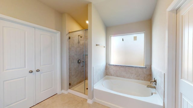 bathroom featuring a garden tub, tile patterned flooring, and a stall shower