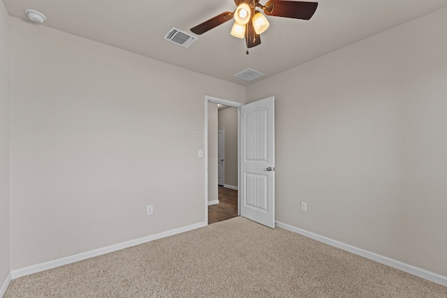 109 Rochester Ln, Hutto, TX 78634 - spare room featuring carpet flooring, baseboards, a ceiling fan, and a smoke detector