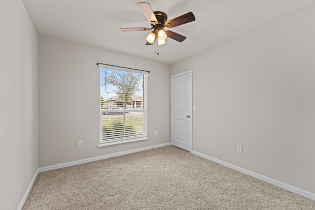 109 Rochester Ln, Hutto, TX 78634 - spare room with light colored carpet, ceiling fan, and baseboards
