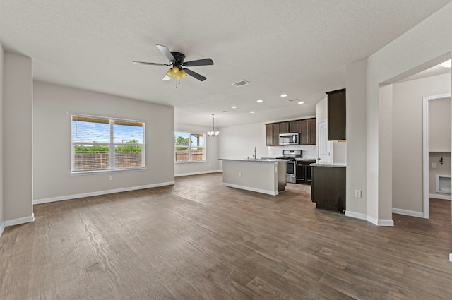 109 Rochester Ln, Hutto, TX 78634 - unfurnished living room with ceiling fan, a sink, dark wood-type flooring, baseboards, and recessed lighting