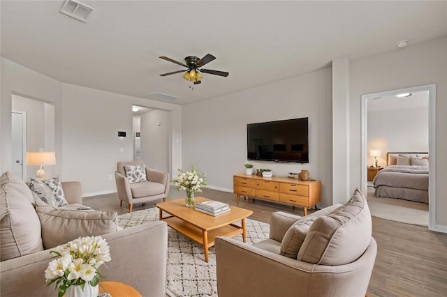 109 Rochester Ln, Hutto, TX 78634 - living room with ceiling fan, wood finished floors, and baseboards