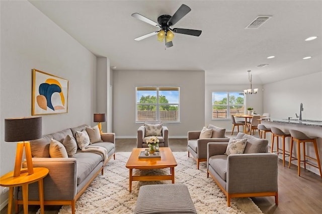 109 Rochester Ln, Hutto, TX 78634 - living area featuring a chandelier, ceiling fan, baseboards, and recessed lighting