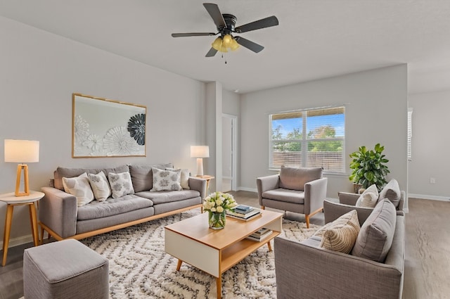 109 Rochester Ln, Hutto, TX 78634 - living area featuring wood finished floors, baseboards, and a ceiling fan