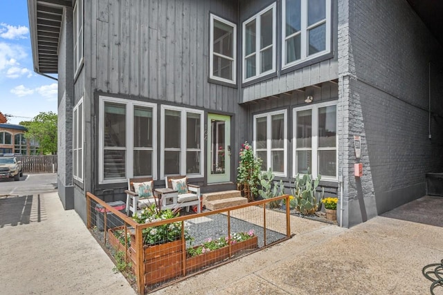 909 Reinli St Unit 104, Austin, TX 78751 - rear view of house with brick siding and entry steps