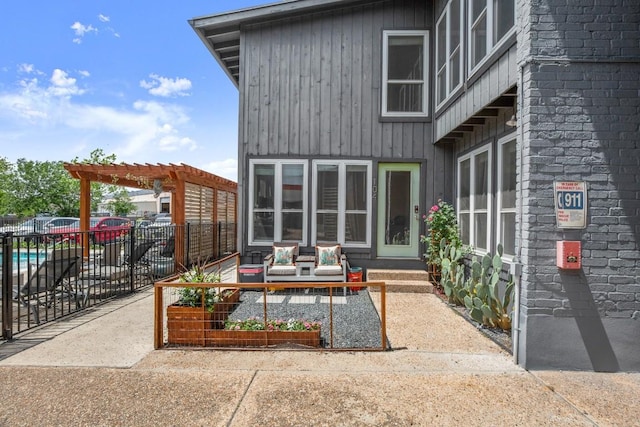 909 Reinli St Unit 104, Austin, TX 78751 - view of patio with a pergola, fence, and an outdoor living space