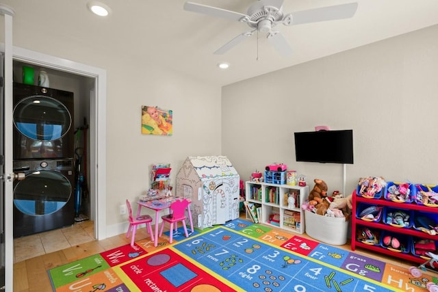 909 Reinli St Unit 104, Austin, TX 78751 - game room with wood finished floors, stacked washer and clothes dryer, recessed lighting, and ceiling fan