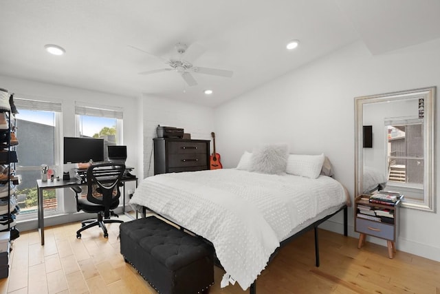 909 Reinli St Unit 104, Austin, TX 78751 - bedroom featuring ceiling fan, vaulted ceiling, light wood-style floors, and recessed lighting