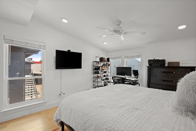 909 Reinli St Unit 104, Austin, TX 78751 - bedroom with recessed lighting, vaulted ceiling, wood finished floors, and a ceiling fan