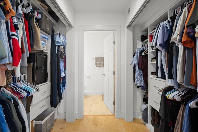 909 Reinli St Unit 104, Austin, TX 78751 - walk in closet featuring light wood-type flooring and visible vents