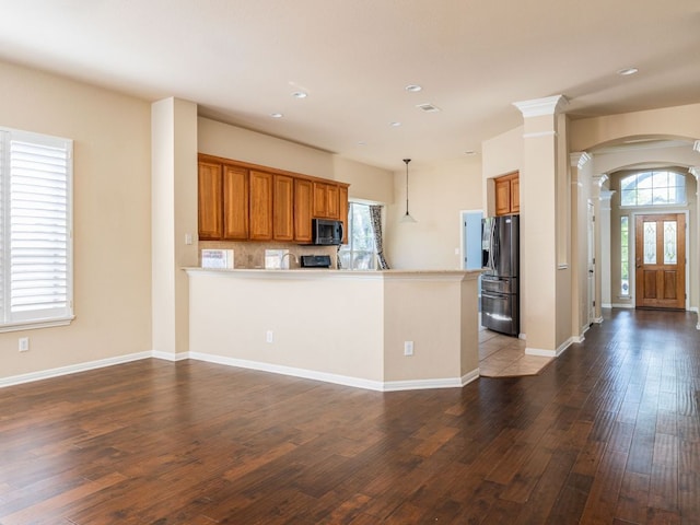 2101 Burnie Bishop Pl, Cedar Park, TX 78613 - kitchen featuring ornate columns, stainless steel fridge with ice dispenser, brown cabinetry, healthy amount of natural light, and recessed lighting