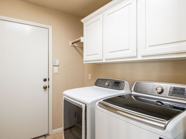 2101 Burnie Bishop Pl, Cedar Park, TX 78613 - laundry area with washer and dryer, cabinet space, and light tile patterned floors