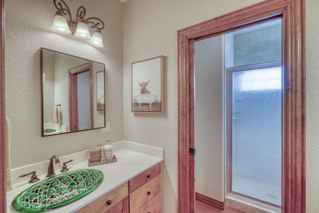 3320 River Oaks Dr, Kingsland, TX 78639 - bathroom with vanity and a textured wall