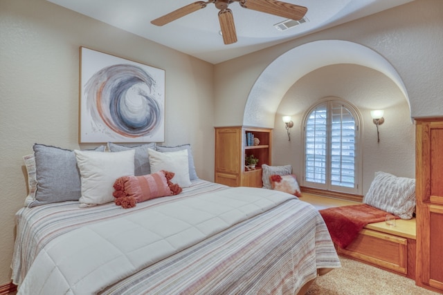 3320 River Oaks Dr, Kingsland, TX 78639 - carpeted bedroom featuring a textured wall and a ceiling fan