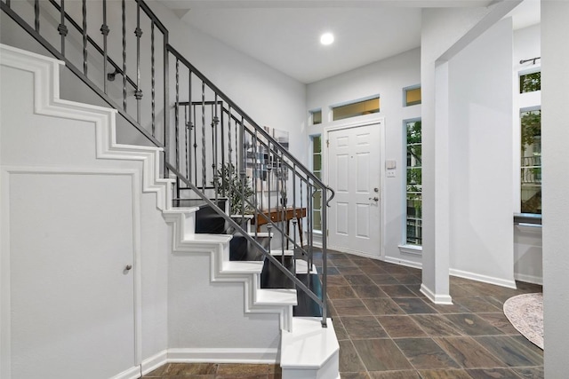 2918 N 620th Rd Unit O282, Austin, TX 78734 - foyer entrance featuring baseboards, healthy amount of natural light, stairs, dark stone finish flooring, and recessed lighting