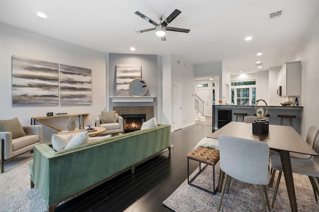 2918 N 620th Rd Unit O282, Austin, TX 78734 - living area with a fireplace, dark wood-style flooring, a ceiling fan, stairs, and recessed lighting