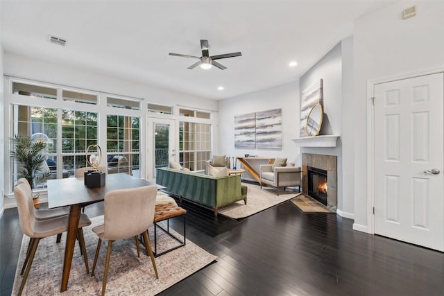 2918 N 620th Rd Unit O282, Austin, TX 78734 - dining space with a ceiling fan, a tiled fireplace, recessed lighting, wood finished floors, and french doors