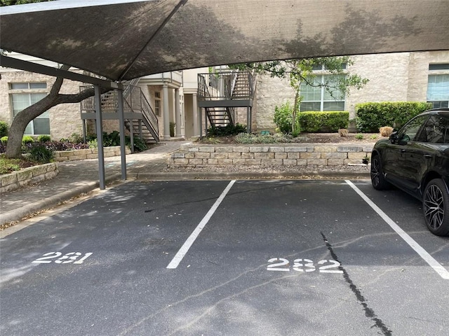 2918 N 620th Rd Unit O282, Austin, TX 78734 - uncovered parking lot featuring stairway