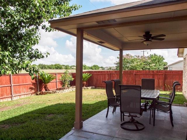 17300 Zola Ln, Round Rock, TX 78664 - fenced backyard featuring a ceiling fan, a patio, and outdoor dining space