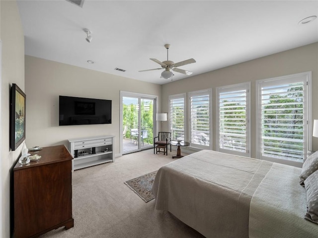 7115 Las Ventanas Dr, Austin, TX 78731 - carpeted bedroom with access to outside and ceiling fan