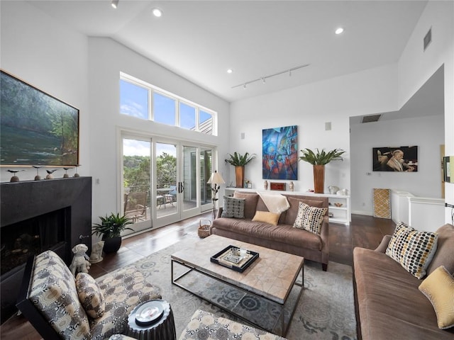 7115 Las Ventanas Dr, Austin, TX 78731 - living room with track lighting, wood finished floors, a premium fireplace, and recessed lighting