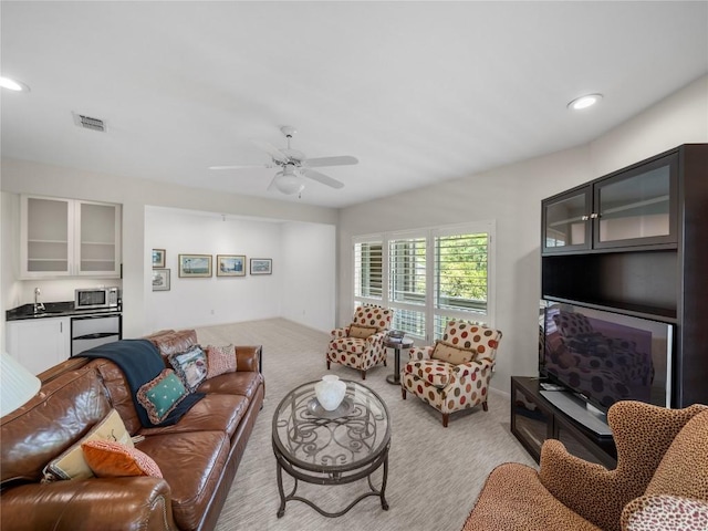 7115 Las Ventanas Dr, Austin, TX 78731 - living area with light carpet, ceiling fan, and recessed lighting