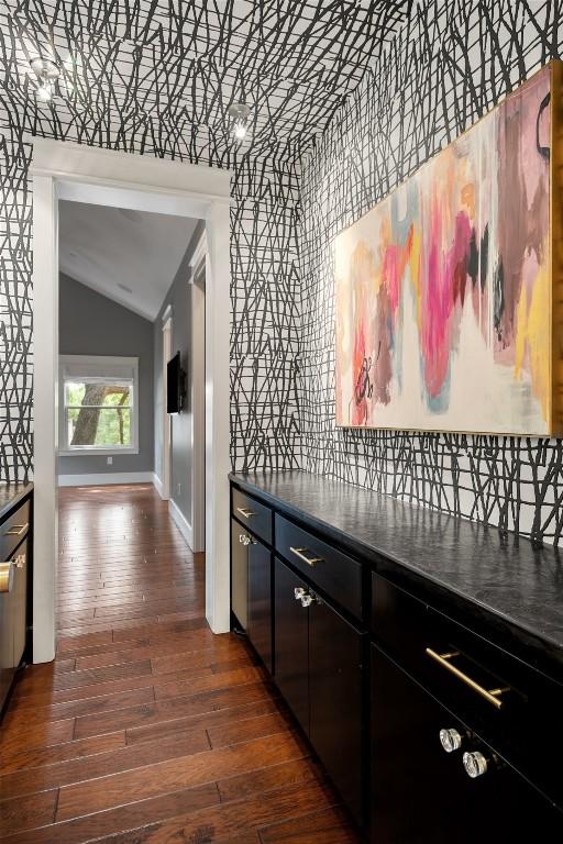 4828 Timberline Dr, Austin, TX 78746 - hall with vaulted ceiling and dark wood finished floors