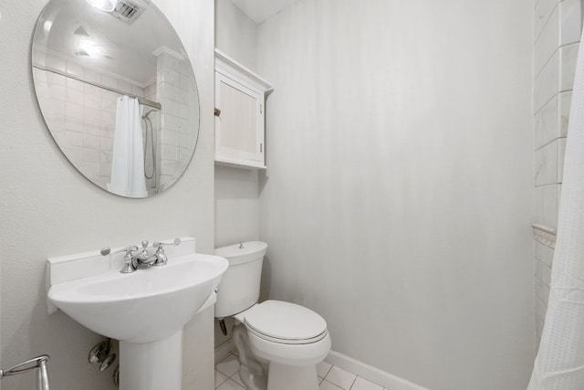 full bathroom featuring a shower with curtain, tile patterned flooring, and toilet