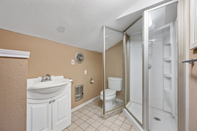 bathroom with a shower stall, heating unit, a textured ceiling, vanity, and toilet