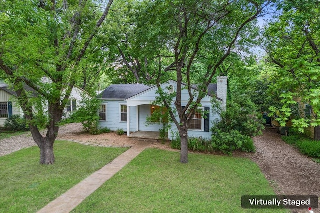3210 Bryker Dr, Austin, TX 78703 - view of front facade featuring a front yard, a chimney, and covered porch