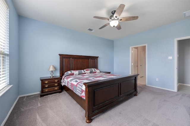 713 Hummingbird Ln, Leander, TX 78641 - bedroom with light colored carpet and ceiling fan