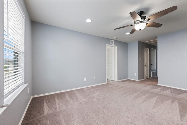 713 Hummingbird Ln, Leander, TX 78641 - unfurnished bedroom featuring multiple windows, carpet floors, recessed lighting, and a ceiling fan