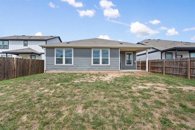 713 Hummingbird Ln, Leander, TX 78641 - rear view of house with a fenced backyard